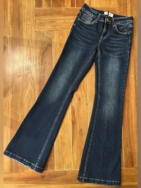 Women’s RISEN Dark Blue Flare Jeans. 1/25